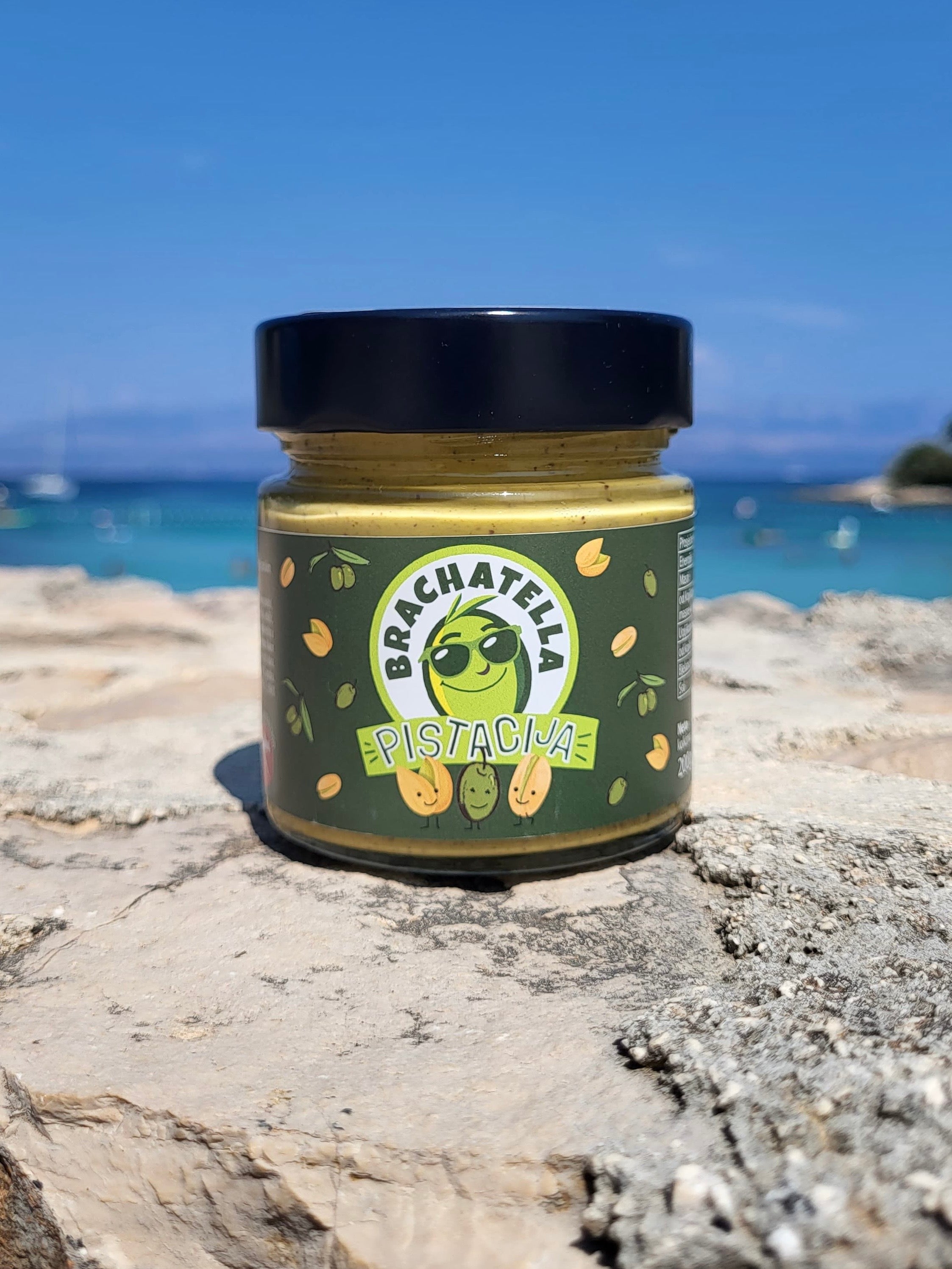 Man holding a pistachio spread jar